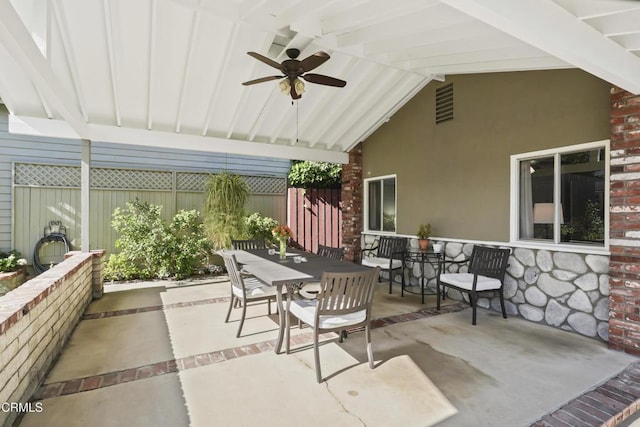 view of patio / terrace featuring outdoor dining space, ceiling fan, and fence