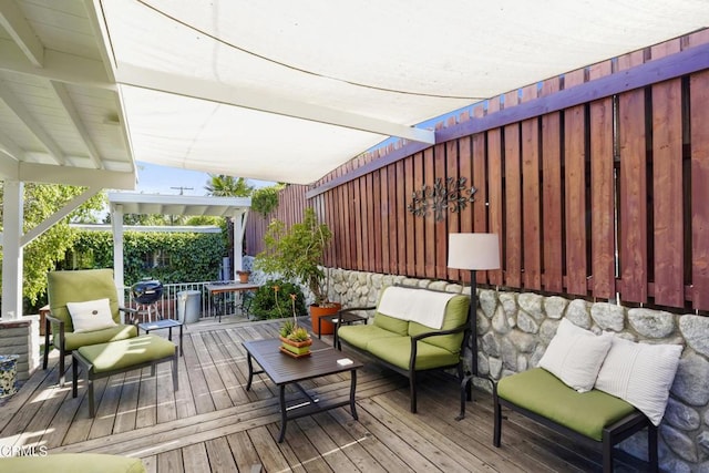 wooden terrace with an outdoor hangout area