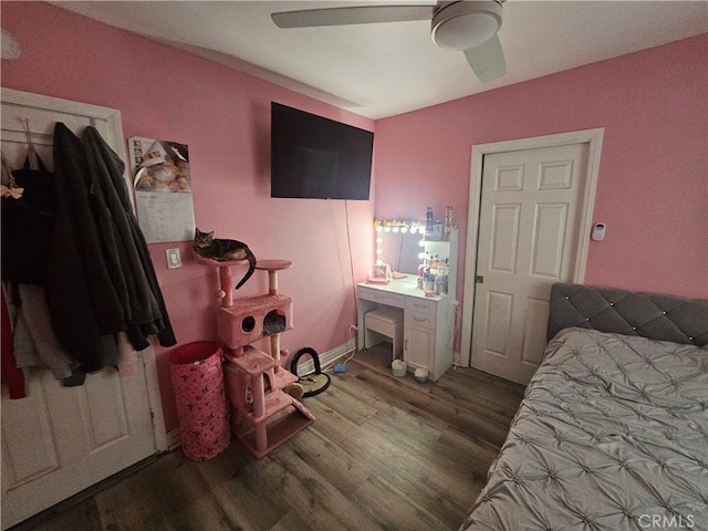 bedroom featuring wood finished floors and ceiling fan