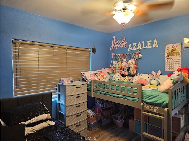 bedroom with wood finished floors and ceiling fan
