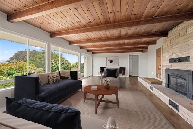 1264 Vista Del Osos, Los Osos, CA 93402 - living area featuring wood finished floors, wooden ceiling, a stone fireplace, beamed ceiling, and baseboards