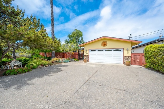 1264 Vista Del Osos, Los Osos, CA 93402 - view of front of house with stone siding, stucco siding, fence, and a garage