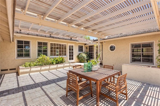 view of patio with outdoor dining area and a pergola