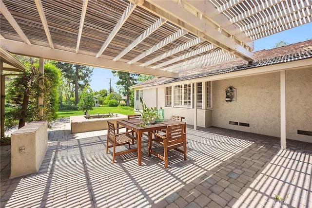 view of patio with outdoor dining area and a pergola