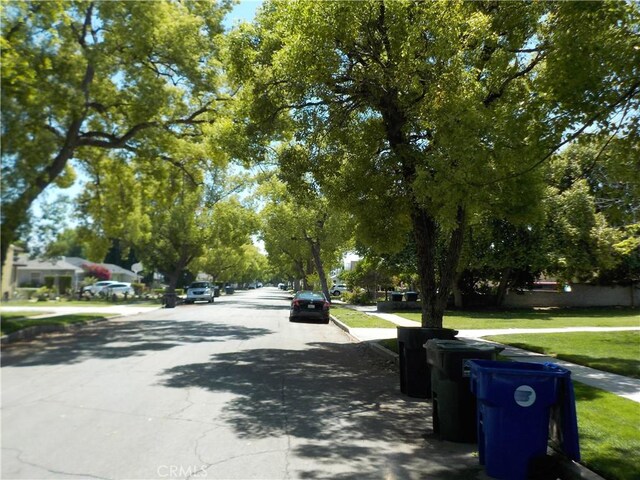 2698 Fremontia Dr, San Bernardino, CA 92404 - view of asphalt street with sidewalks and curbs