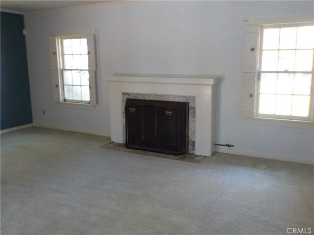 2698 Fremontia Dr, San Bernardino, CA 92404 - unfurnished living room with carpet floors, a fireplace, and healthy amount of natural light