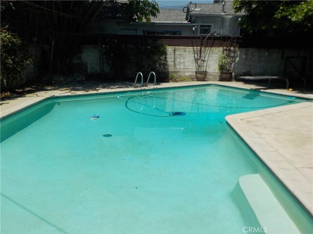 2698 Fremontia Dr, San Bernardino, CA 92404 - view of swimming pool with a fenced backyard