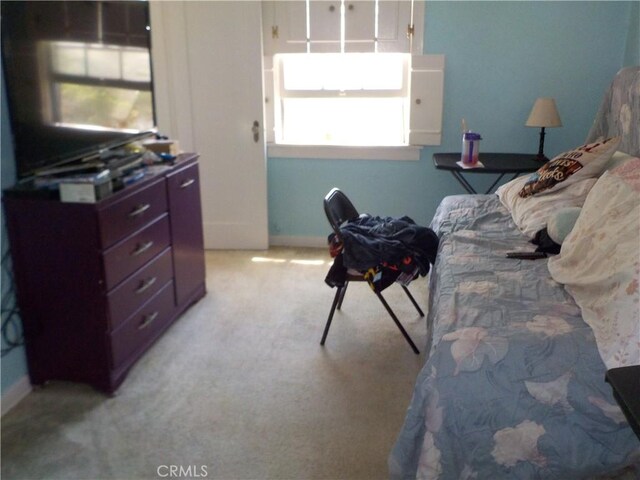 2698 Fremontia Dr, San Bernardino, CA 92404 - bedroom featuring light carpet and baseboards