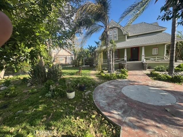 850 E Columbia Ave, Pomona, CA 91767 - view of front of home featuring covered porch and roof with shingles