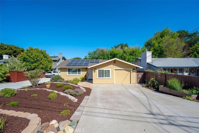 4517 Mananita Ave, Atascadero, CA 93422 - ranch-style home with driveway, fence, solar panels, and a garage