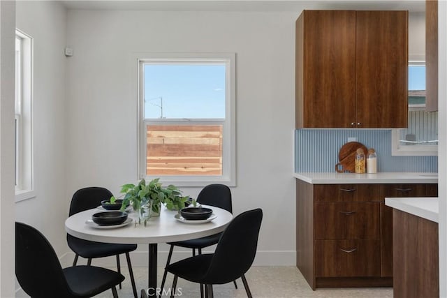 dining space with baseboards