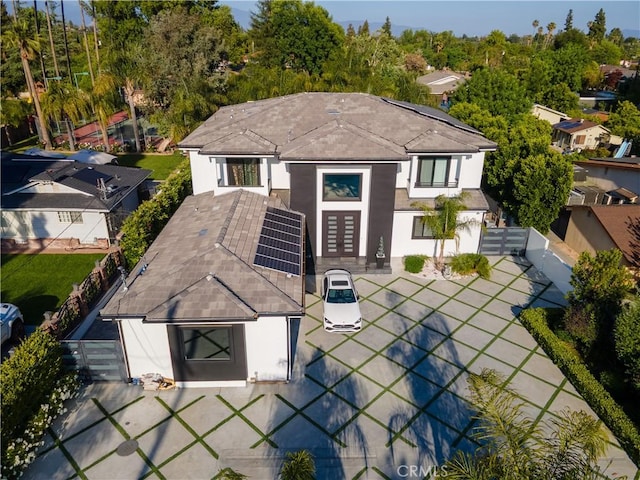 9218 Encino Ave, Northridge, CA 91325 - back of house featuring stucco siding, french doors, fence, solar panels, and a patio area