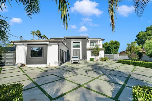 9218 Encino Ave, Northridge, CA 91325 - back of property with fence, stucco siding, and a gate