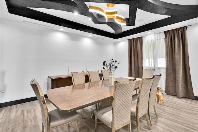 9218 Encino Ave, Northridge, CA 91325 - dining room featuring a raised ceiling and light wood finished floors