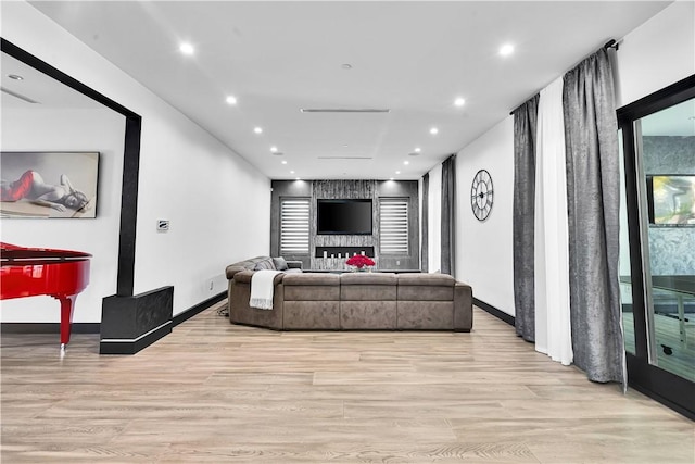 9218 Encino Ave, Northridge, CA 91325 - living area featuring light wood-style flooring, recessed lighting, and baseboards