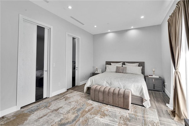 9218 Encino Ave, Northridge, CA 91325 - bedroom featuring recessed lighting, wood finished floors, and baseboards