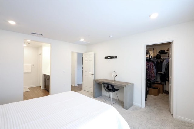 25601 Pine Ridge Rd, Homeland, CA 92548 - bedroom featuring a walk in closet, recessed lighting, baseboards, ensuite bath, and a closet