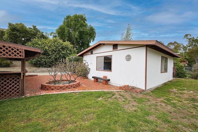 back of property featuring a patio area