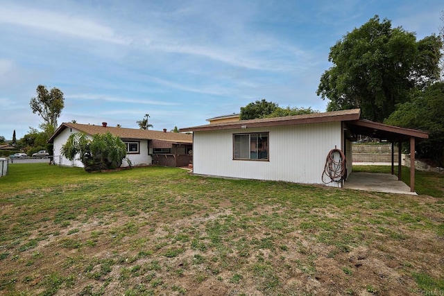 rear view of property with a patio area