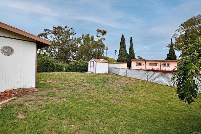 view of yard with a storage shed and an outdoor structure