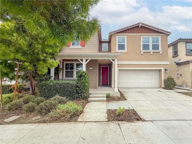 view of front of home with concrete driveway and an attached garage