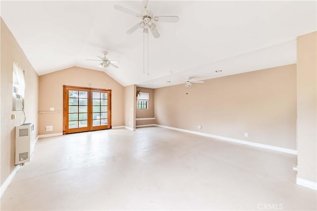 unfurnished room with a ceiling fan, concrete flooring, french doors, lofted ceiling, and baseboards