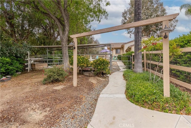 view of yard with fence and a gate