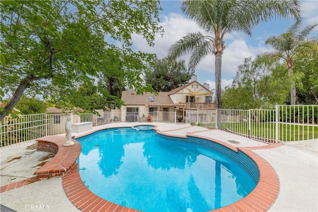 view of swimming pool with fence and a patio area