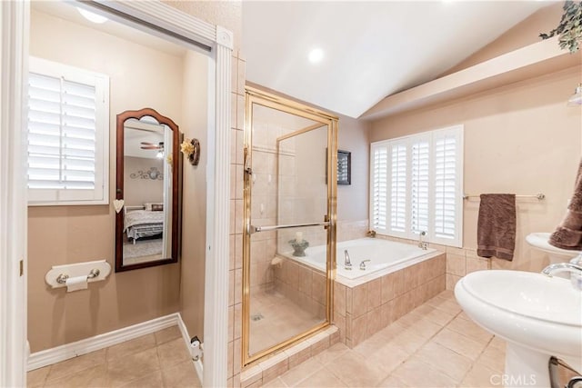 ensuite bathroom featuring a shower stall, vaulted ceiling, plenty of natural light, a bath, and tile patterned flooring