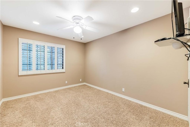 unfurnished room with carpet flooring, a ceiling fan, baseboards, and recessed lighting