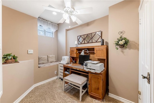 office with ceiling fan, baseboards, and light carpet