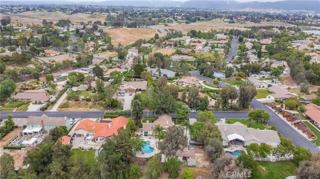 29620 Valle Olvera, Temecula, CA 92591 - aerial view of property and surrounding area featuring nearby suburban area and mountains
