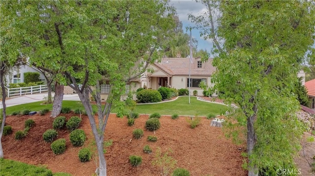 view of front of home featuring a tile roof and stucco siding
