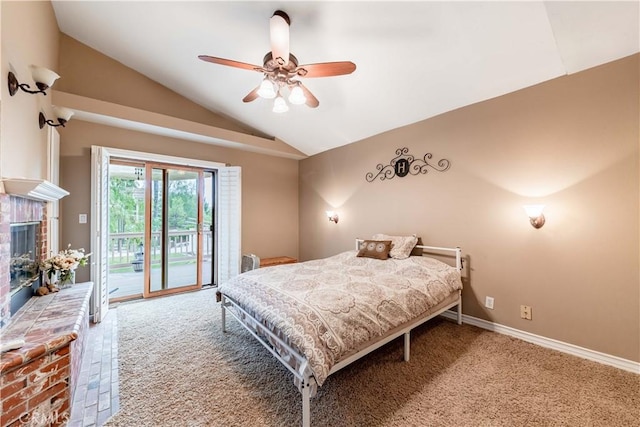 bedroom with vaulted ceiling, access to exterior, carpet floors, a brick fireplace, and a ceiling fan
