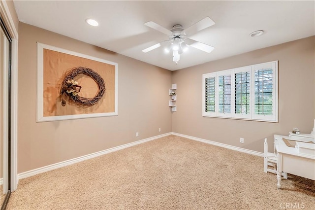 empty room with carpet floors, ceiling fan, baseboards, and recessed lighting