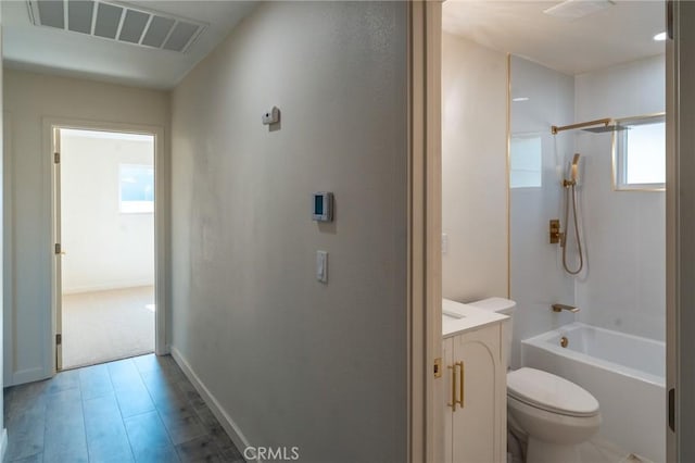 818 Invergarry St, Glendora, CA 91741 - bathroom with toilet, shower / washtub combination, vanity, wood finished floors, and baseboards