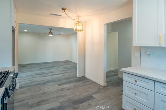 818 Invergarry St, Glendora, CA 91741 - kitchen featuring stainless steel range with gas stovetop, ceiling fan, light stone countertops, a chandelier, and light wood-type flooring