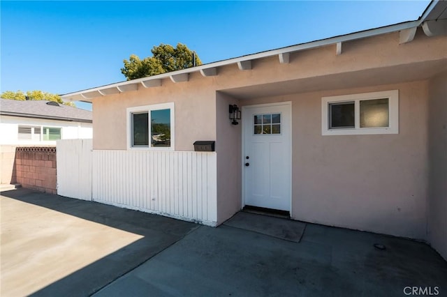 818 Invergarry St, Glendora, CA 91741 - property entrance with a patio area, stucco siding, and fence