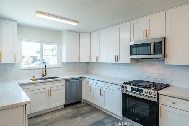 818 Invergarry St, Glendora, CA 91741 - kitchen with appliances with stainless steel finishes, a sink, and white cabinetry