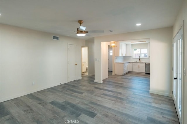 818 Invergarry St, Glendora, CA 91741 - unfurnished living room featuring a ceiling fan, recessed lighting, baseboards, wood finished floors, and a sink