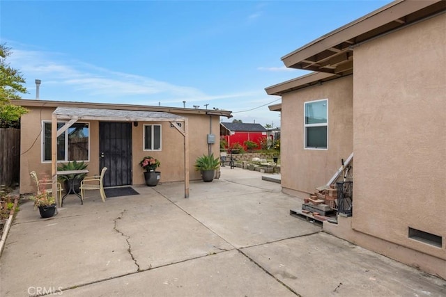 4731-33 Austin Dr, San Diego, CA 92115 - rear view of house featuring stucco siding, fence, and a patio area