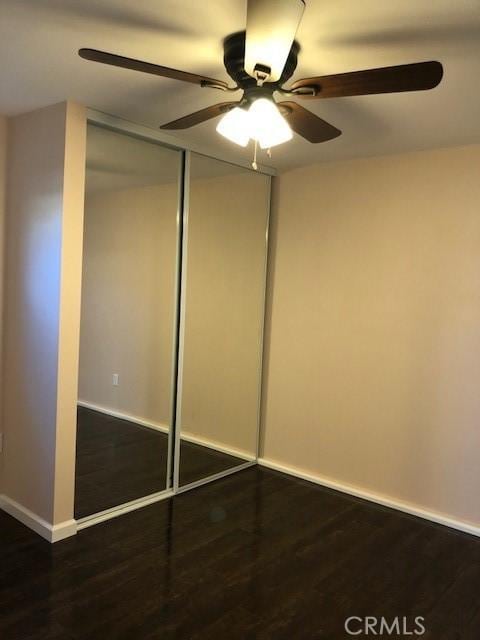 4731-33 Austin Dr, San Diego, CA 92115 - unfurnished bedroom with wood finished floors, a ceiling fan, baseboards, and a closet