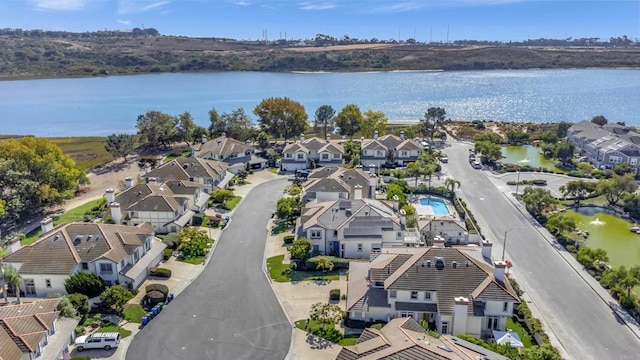 aerial view of residential area with a nearby body of water