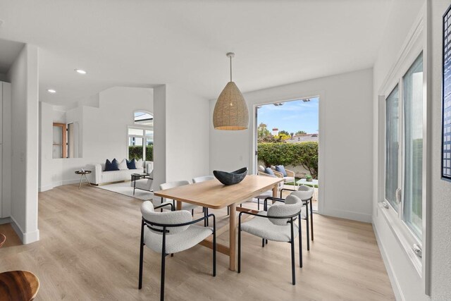dining space with light wood-type flooring, baseboards, and recessed lighting