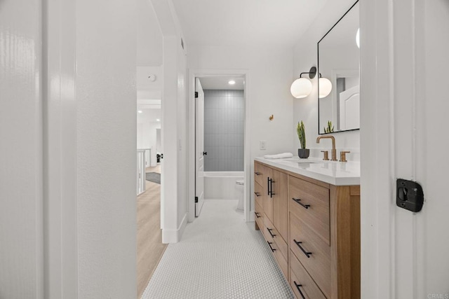 bathroom featuring vanity, washtub / shower combination, recessed lighting, and tile patterned flooring