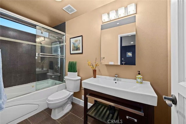 128 N Allen Ave Unit 1, Pasadena, CA 91106 - full bathroom with toilet, bath / shower combo with glass door, vanity, and baseboards