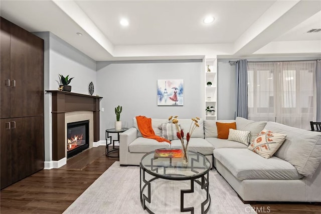 128 N Allen Ave Unit 1, Pasadena, CA 91106 - living room with wood finished floors, a raised ceiling, a glass covered fireplace, recessed lighting, and baseboards