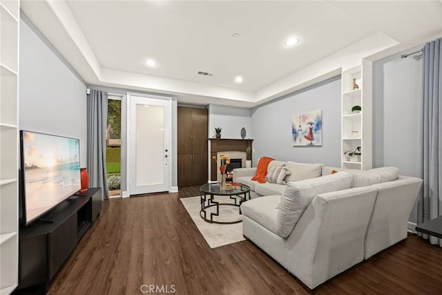 128 N Allen Ave Unit 1, Pasadena, CA 91106 - living area with dark wood-type flooring, a raised ceiling, a fireplace, and recessed lighting