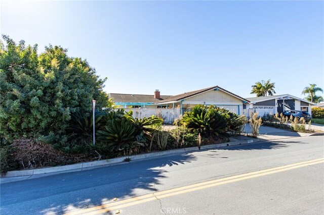 4101 Calle Mayo, San Clemente, CA 92673 - view of front of house featuring fence, driveway, and an attached garage