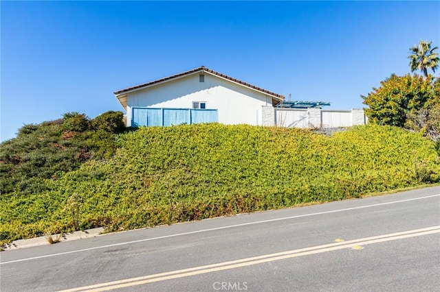 4101 Calle Mayo, San Clemente, CA 92673 - view of home's exterior with a tile roof and stucco siding